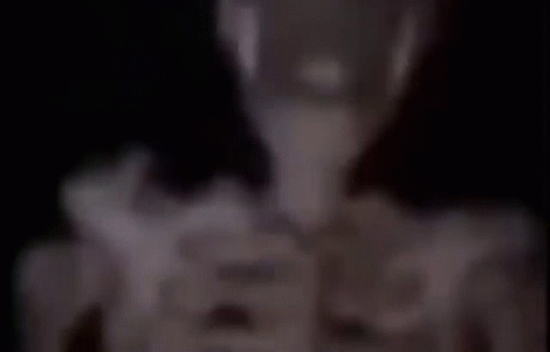 A Blurry Picture Of A Person 'S Face With A Triangle On It GIF