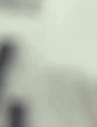 A Blurry Picture Of A Person 'S Face With A White Background GIF
