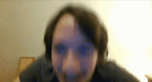 A Blurry Picture Of A Person 'S Face With A White Background GIF
