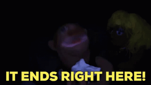 A Blurry Picture Of A Person 'S Face With The Words `` It Ends Right Here '' In Yellow Letters . GIF