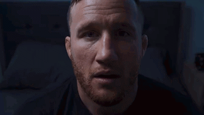 A Blurry Picture Of A Person Standing In A Dark Room In Front Of A Window . GIF