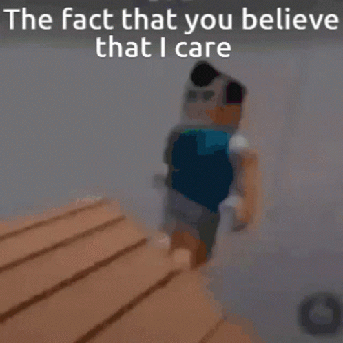 A Blurry Picture Of A Person Standing Next To A Wooden Table With The Words `` The Fact That You Believe That I Care '' GIF