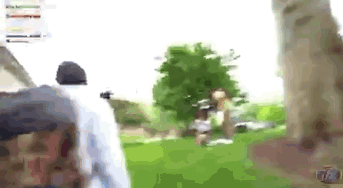A Blurry Picture Of A Person Walking In A Park . GIF