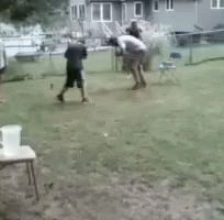 A Blurry Picture Of A Person Walking On A Grassy Field GIF