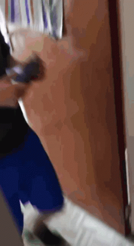 Blurry Person Walking Through Door GIF