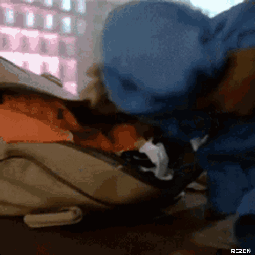 A Blurry Picture Of A Person With The Word Rezen On The Bottom Right Corner GIF