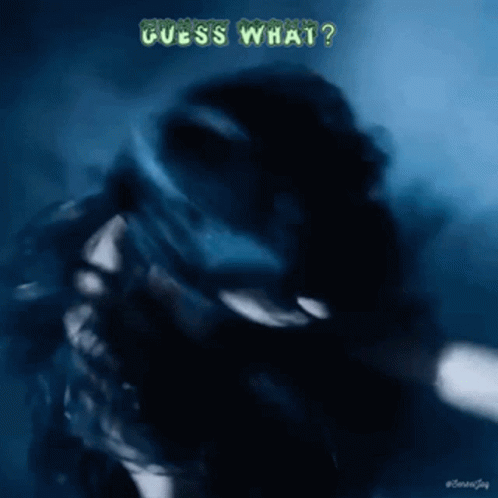 A Blurry Picture Of A Person With The Words Guess What Written On It GIF