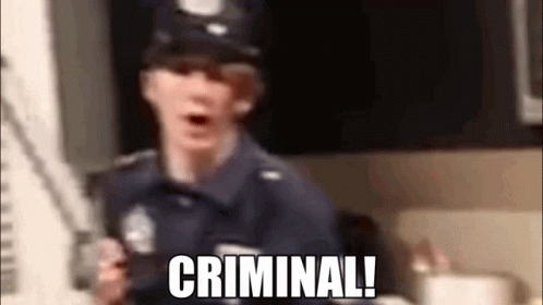 A Blurry Picture Of A Police Officer With The Words Criminal Written On It GIF