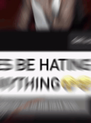 A Blurry Picture Of A Sign That Says " Be Hating Nothing " GIF