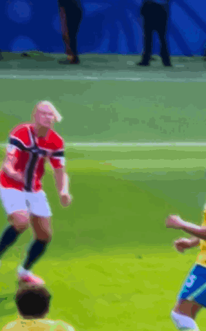 A Blurry Picture Of A Soccer Game With A Player Wearing The Number 5 GIF