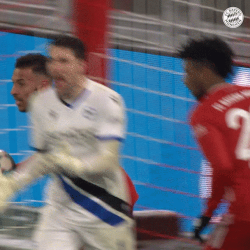 A Blurry Picture Of A Soccer Game With The Number 2 On The Back Of A Player 'S Jersey GIF