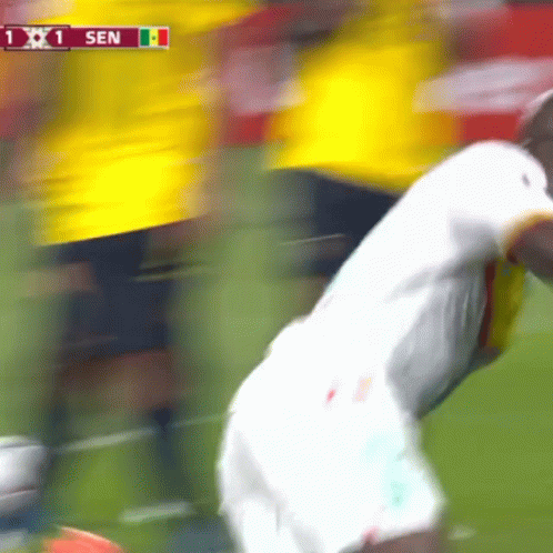 a blurry picture of a soccer game with the score 1 to 1