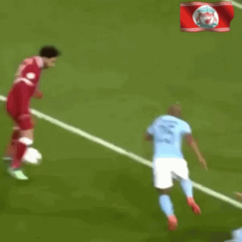 A Blurry Picture Of A Soccer Player Getting Ready To Kick The Ball Into The Goal GIF