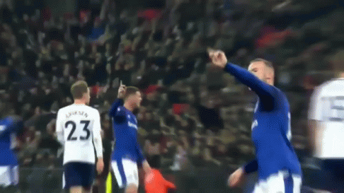 A Blurry Picture Of A Soccer Player Wearing Number 23 GIF