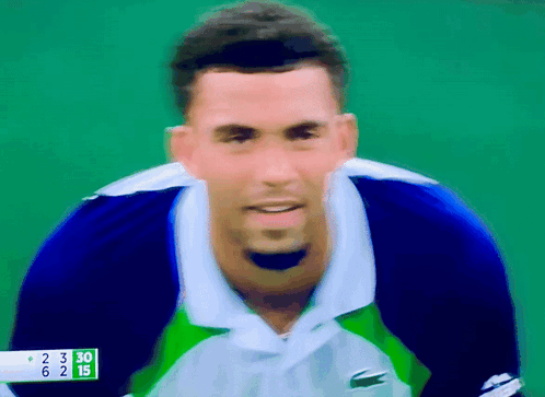 a blurry picture of a tennis player with a score of 30