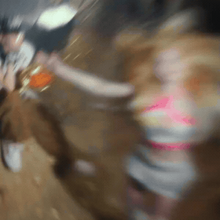 A Blurry Picture Of A Woman In A Pink Dress GIF