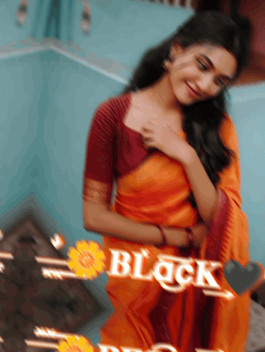A Blurry Picture Of A Woman In An Orange Saree With The Word Black Written On It GIF