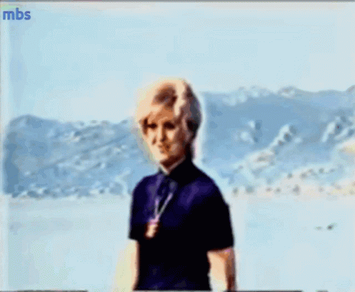 A Blurry Picture Of A Woman With Mbs Written On The Bottom Left GIF
