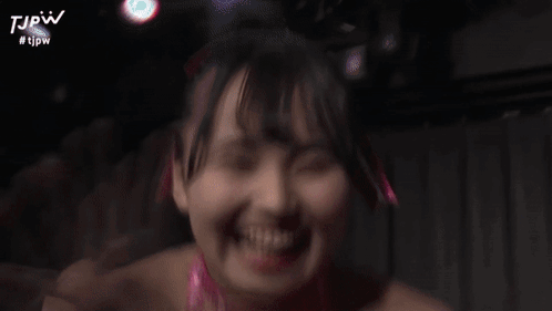 a blurry picture of a woman with the hashtag #tjpw on the bottom right