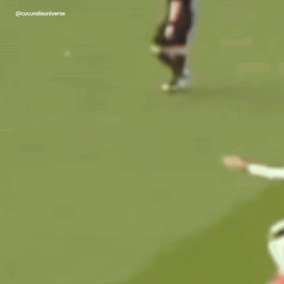 A Blurry Picture Of Soccer Players With One Wearing The Number 5 GIF