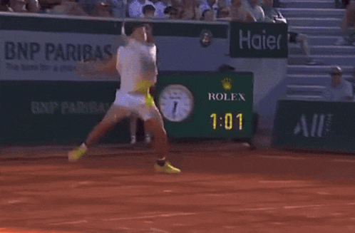 A Bnp Paribas Ad Can Be Seen In The Background Of A Tennis Match GIF