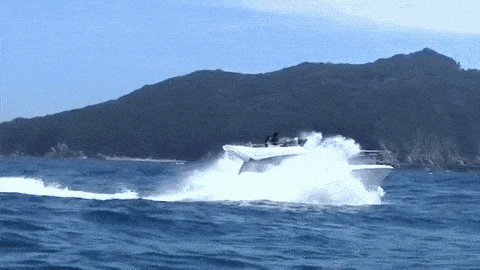 A Boat Is Going Very Fast In The Ocean GIF