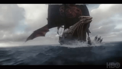 A Boat With A Dragon On It Is Floating In The Ocean GIF