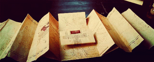 A Book Is Open To A Page That Says " Harry Potter " GIF