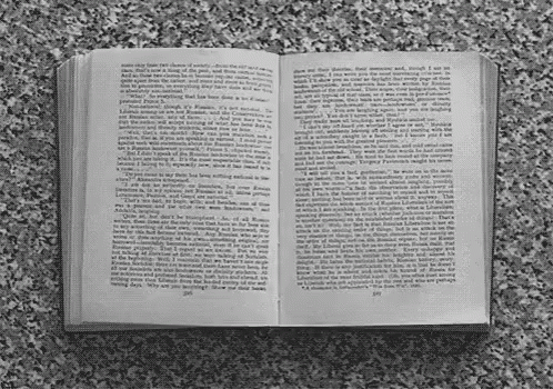 A Book Is Open To A Page That Says ' I 'M Sorry ' On It GIF