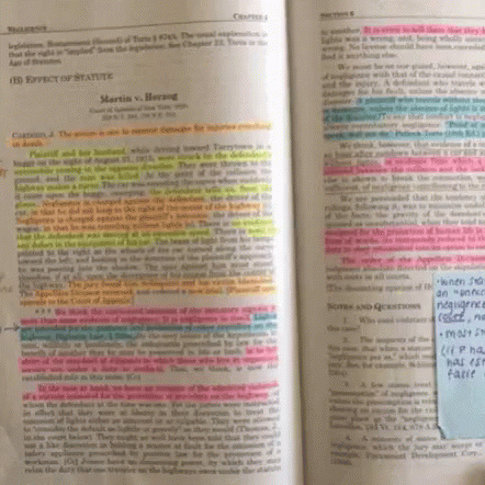 A Book Is Open To A Page That Says ' Zemi V. Anderson ' On It GIF