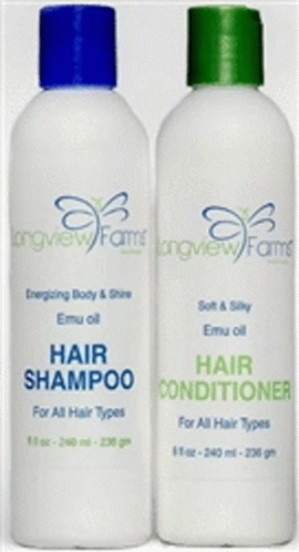 A Bottle Of All Natural Skin Bleaching Lotion With A Black Cap GIF