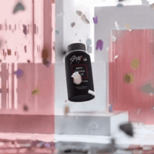 A Bottle Of Anti Dandruff Shampoo Is Falling In The Air GIF