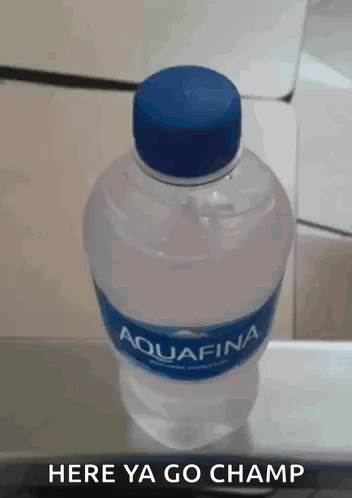 A Bottle Of Aquafina Water With A Blue Cap GIF