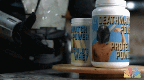 A Bottle Of Deathwatch Protein Powder Sits Next To A Bottle Of Child 'S Whey Protein Powder GIF