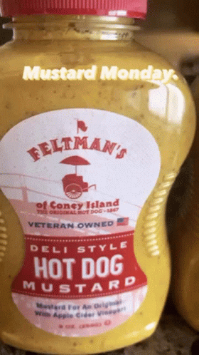 A Bottle Of Feltman 'S Hot Dog Mustard Is On A Counter GIF