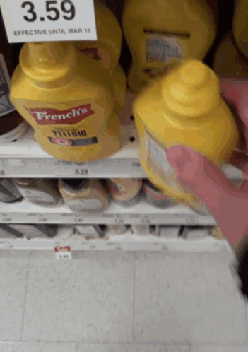 A Bottle Of French 'S Yellow Mustard Sits On A Shelf GIF