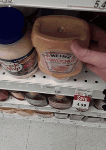 A Bottle Of Heinz Mayonnaise Sits On A Shelf In A Store GIF