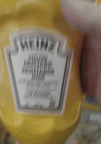 A Bottle Of Heinz Mustard Sits On A Counter GIF