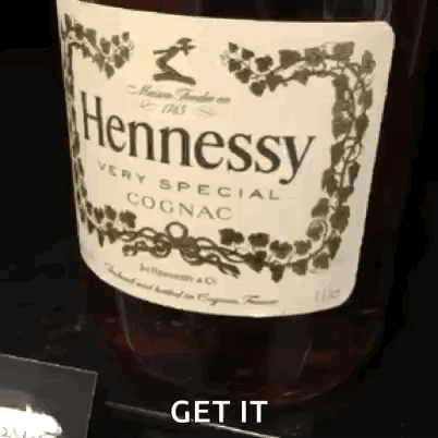 A Bottle Of Hennessy Very Special Cognac Is On A Table GIF