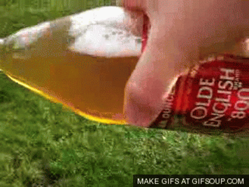 A Bottle Of Olde English Cider Being Poured Into A Glass GIF