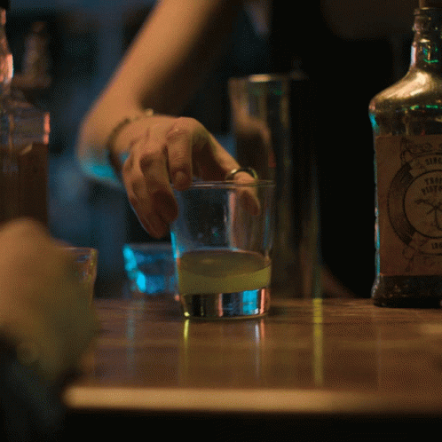 A Bottle Of Sierra Nevada Tequila Sits On A Wooden Table GIF