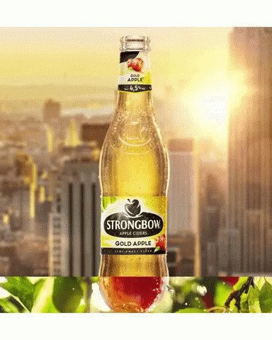 A Bottle Of Strongbow Apple Cider In Front Of A Cityscape GIF