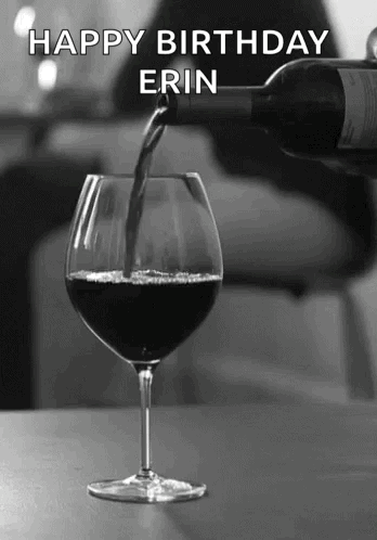A Bottle Of Wine Is Being Poured Into A Glass With The Name Erin Written On The Bottom GIF