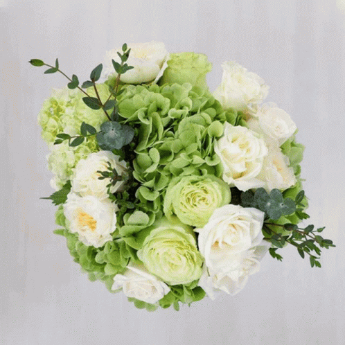 A Bouquet Of Colorful Flowers Including Roses And Chrysanthemums GIF