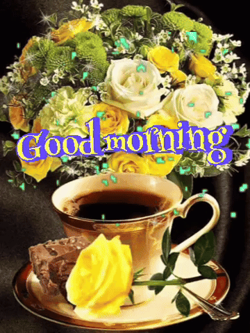a bouquet of flowers and a cup of coffee with the words good morning written on it