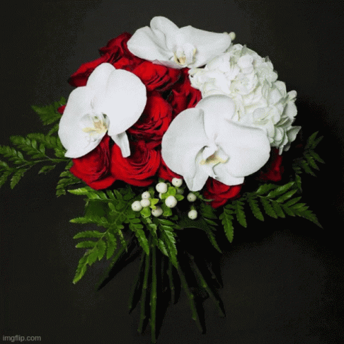 A Bouquet Of Pink And White Flowers With A Grace Favour Ribbon GIF