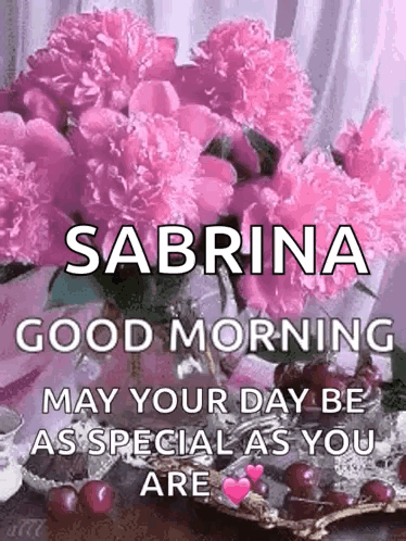 A Bouquet Of Pink Flowers In A Vase With The Name Sabrina On It . GIF