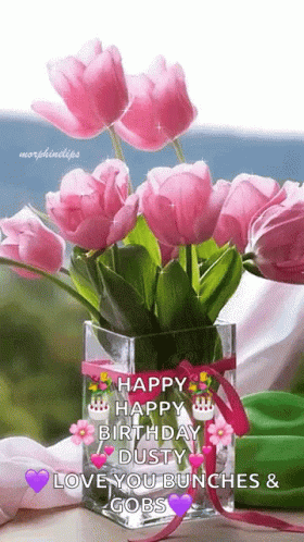 A Bouquet Of Pink Flowers In A Vase With The Words Happy Birthday Dusty Love You Bunches And Gobs On It GIF