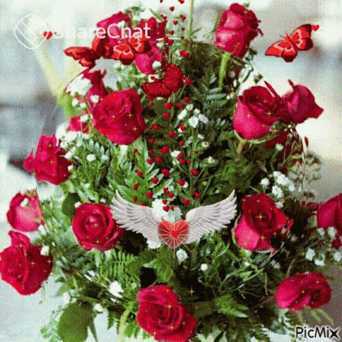 A Bouquet Of Red Roses With A Picture Of An Angel With Wings On It GIF