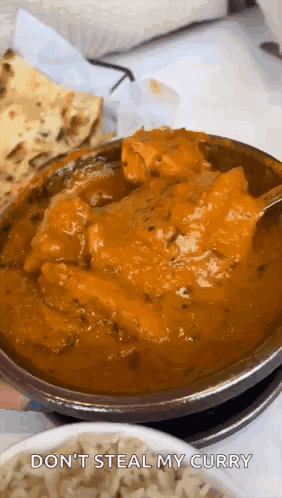 A Bowl Of Curry With A Spoon In It And The Words `` Do N't Steal My Curry '' On The Bottom . GIF